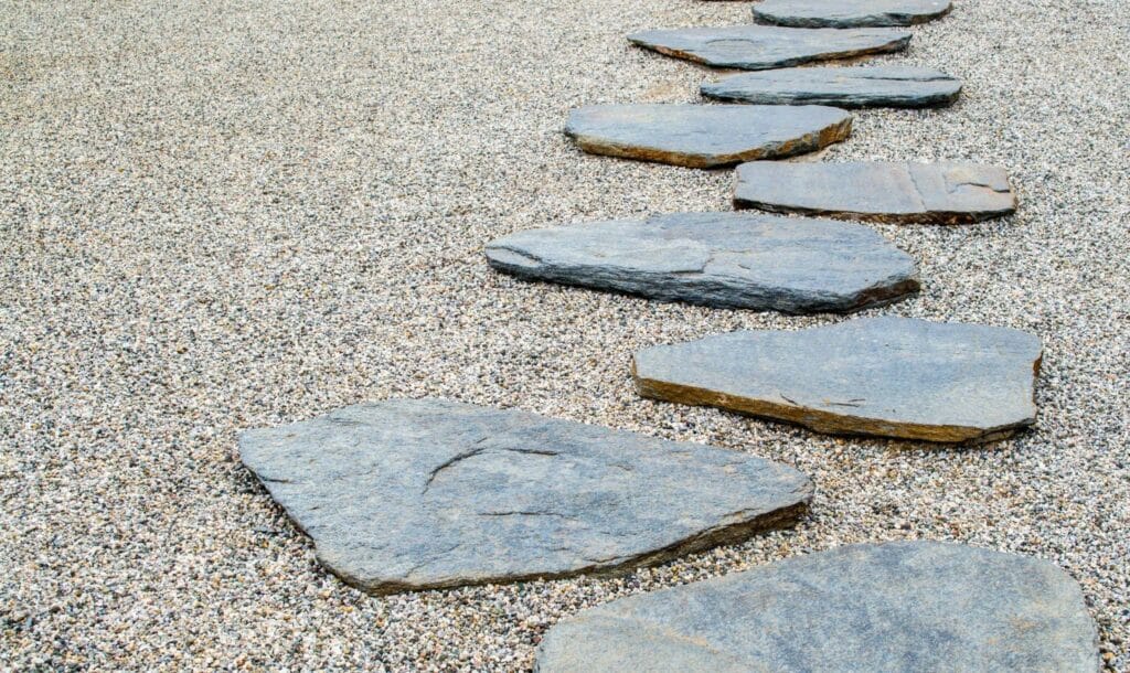 5 Small Garden Ideas on a Budget 1 | The Rock Garden flat stepping stones atop a sandy gravel mix
