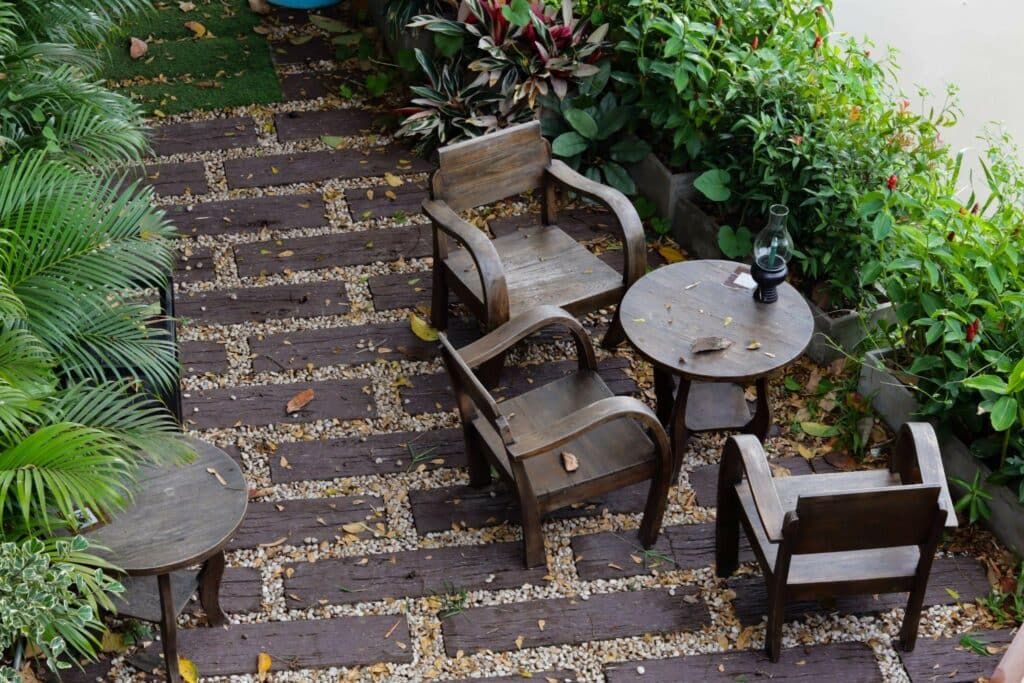 5 Small Garden Ideas on a Budget 4 | The Rock Garden wooden furniture arrayed on a natural stone patio, aerial view